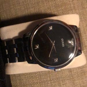 Silver and black faced guess watch